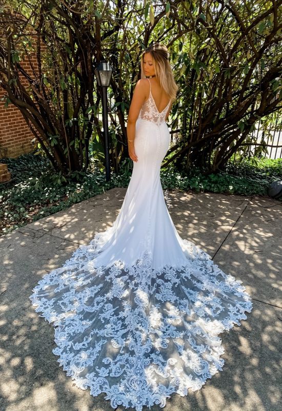 Crepe lace dress with spaghetti straps and removable off the shoulder straps and long train at Love it at Stella's Bridal in Westminster, MD