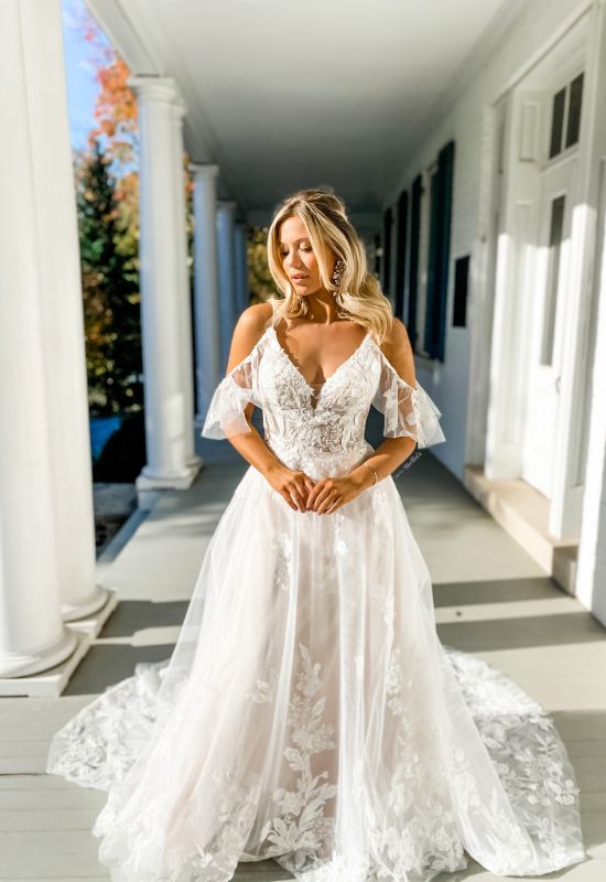 Sole wedding dress with lace details at Love it at Stella's Bridal in Westminster, Maryland bridal shop