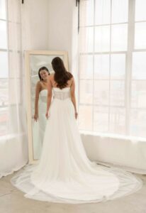 Serene by Madi Lane Roman Sheer Fitted Wedding Dress at love it at stella's bridal boutique in Westminster Maryland