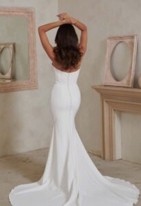Levi - Stella's Bridal Serene by Madi Lane Levi Fitted Crepe Wedding Dress with Basque Waist at Love it at Stellas Bridal in Westminster Maryland