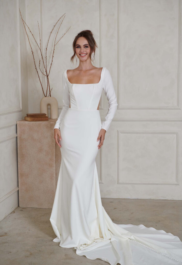 Madi Lane Serene North Crepe Fitted Wedding Dress with a Low Back at Love it at Stella's Bridal Shop in Westminster, Maryland