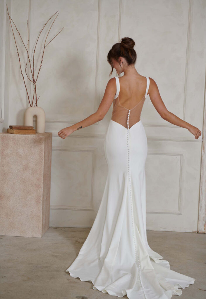 Madi Lane Serene North Crepe Fitted Wedding Dress with a Low Back at Love it at Stella's Bridal Shop in Westminster, Maryland