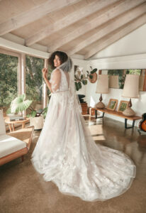 Sophie - Stella's Bridal An a-line wedding dress in tulle, featuring floral lace appliques and a deep plunge. Shown in Silver/Purple/Ivory and designed by Casablanca Bridal. A modern bridal gown available at Stella’s Bridal in Westminster, Maryland. Casablanca Beloved Bridal Style BL395C Sophie.
