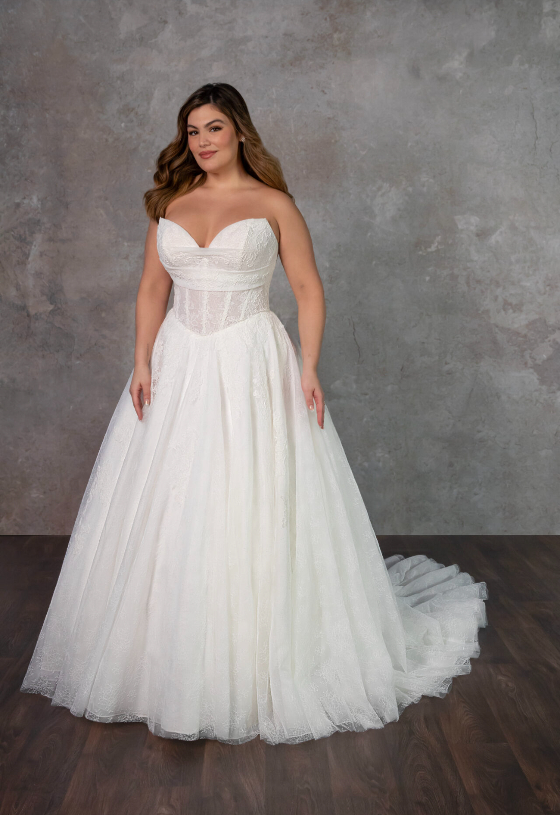 Mariposa - Stella's Bridal A ballgown wedding dress in lace, featuring a cat-eye neckline and basque waist. Shown in Ivory and designed by Essense of Australia Bridal. A modern bridal gown available at Stella’s Bridal in Westminster, Maryland. Essense of Australia style D4270.