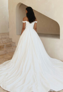 Amanda J - Stella's Bridal Serene by Madi Lane Amanda wedding dress featuring a ballgown silhouette with scoop neckline, jacquard satin skirt, and ruched details. Available at Stella’s Bridal in Westminster, Maryland.