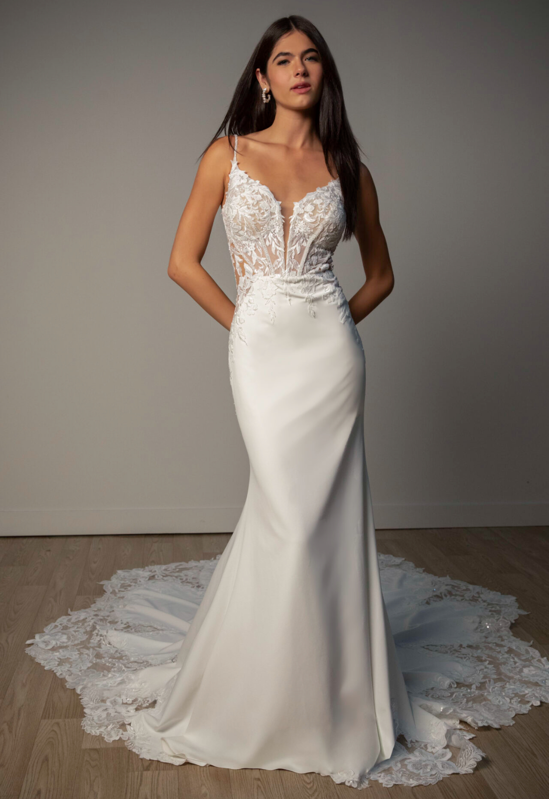Amelia - Stella's Bridal Stella York SY8340 wedding dress featuring a fit and flare silhouette with plunge neckline, crepe skirt, and lace details. Available at Stella’s Bridal in Westminster, Maryland