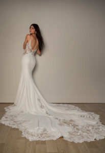 Stella York SY8340 wedding dress featuring a fit and flare silhouette with plunge neckline, crepe skirt, and lace details. Available at Stella’s Bridal in Westminster, Maryland