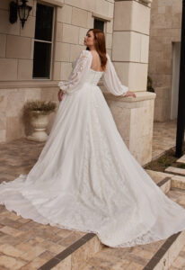 Cecelia - Stella's Bridal Evie Young Cecelia wedding dress featuring an a-line silhouette with sweetheart neckline, chiffon skirt, and boho lace details. Available at Stella’s Bridal in Westminster, Maryland.
