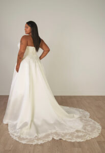 Catherine - Stella's Bridal Stella York SY8279 wedding dress featuring a ballgown silhouette with straight neckline, satin skirt, and lace details. Available at Stella’s Bridal in Westminster, Maryland