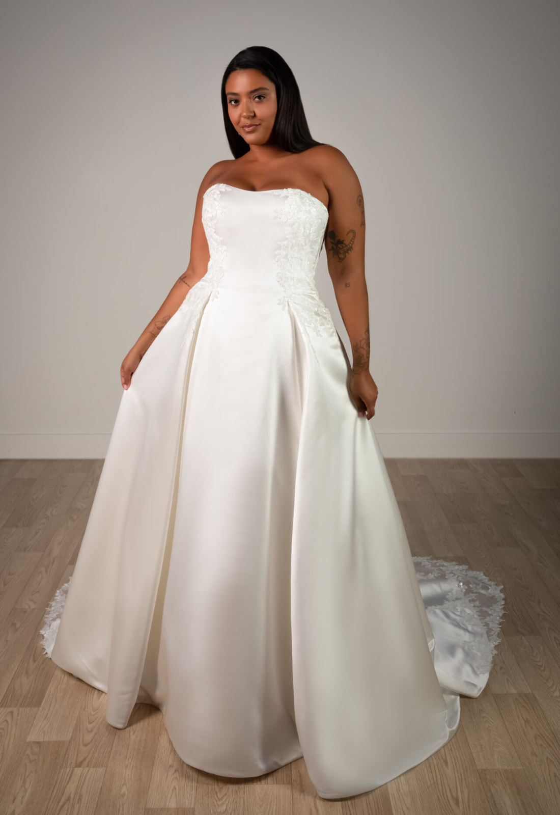 Catherine - Stella's Bridal Stella York SY8279 wedding dress featuring a ballgown silhouette with straight neckline, satin skirt, and lace details. Available at Stella’s Bridal in Westminster, Maryland
