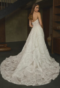 Coralie - Stella's Bridal Casablanca Coralie wedding dress featuring a ballgown silhouette with straight neckline, starry night lace skirt, and floral details. Available at Stella’s Bridal in Westminster, Maryland.