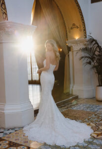 Dorian - Stella's Bridal Essense of Australia D4541 wedding dress featuring a fitted silhouette with cat-eye neckline, lace skirt, and boho details. Available at Stella’s Bridal in Westminster, Maryland.