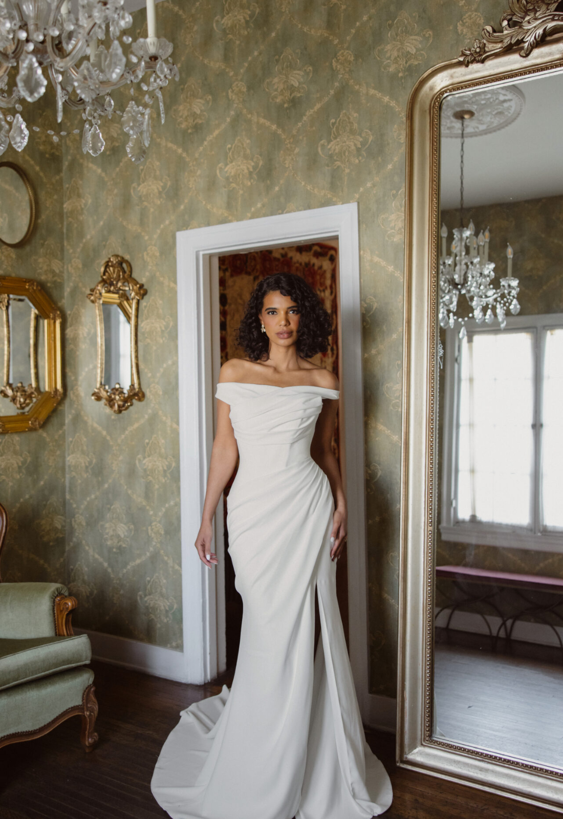 Ellowen Essense of Australia D4563 wedding dress featuring a fitted silhouette with straight neckline, crepe skirt, and ruched details. Available at Stella’s Bridal in Westminster, Maryland.
