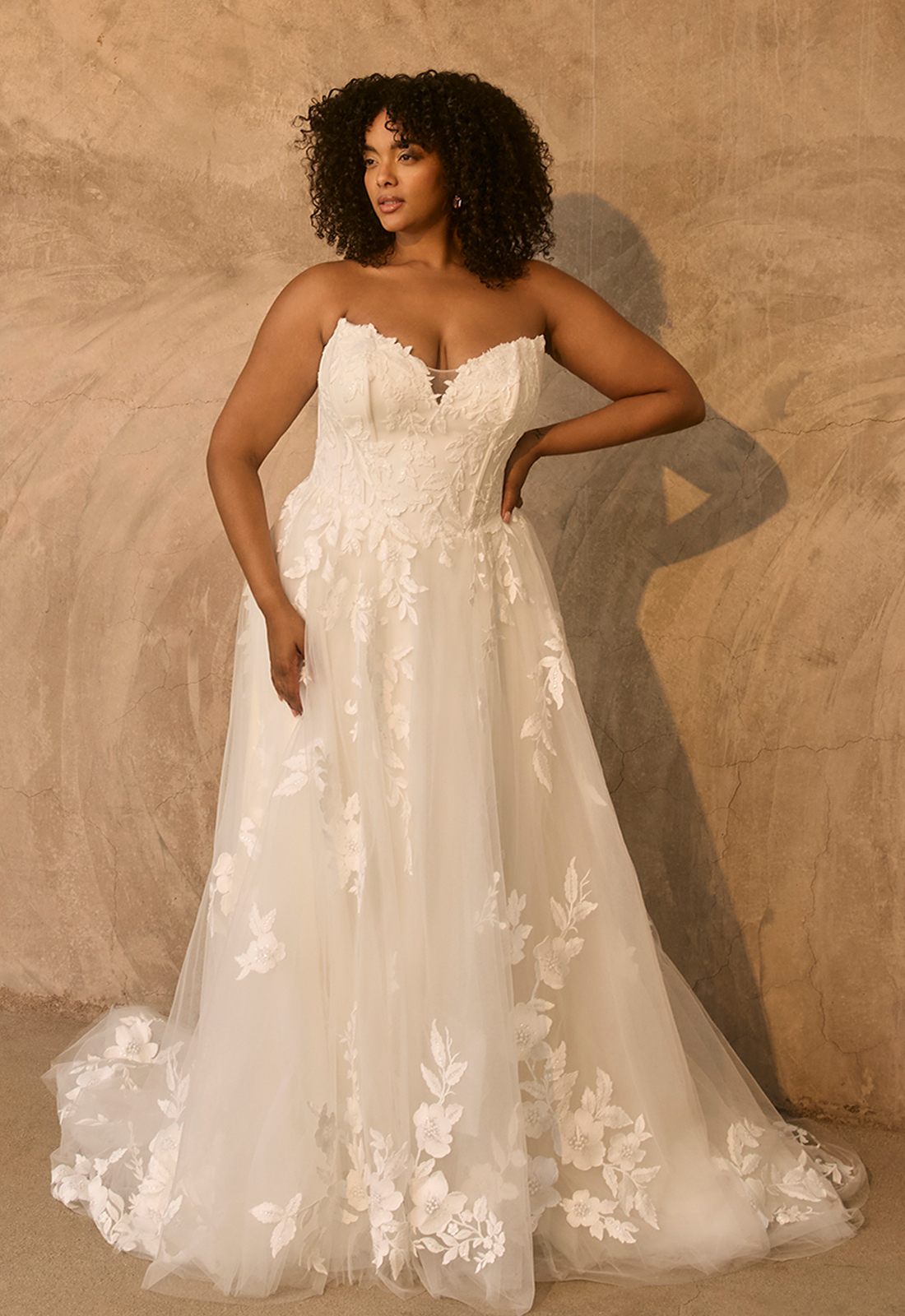 Garnet - Stella's Bridal Beloved by Casablanca Garnet wedding dress featuring an a-line silhouette with cat-eye neckline, tulle skirt, and lace details. Available at Stella’s Bridal in Westminster, Maryland.