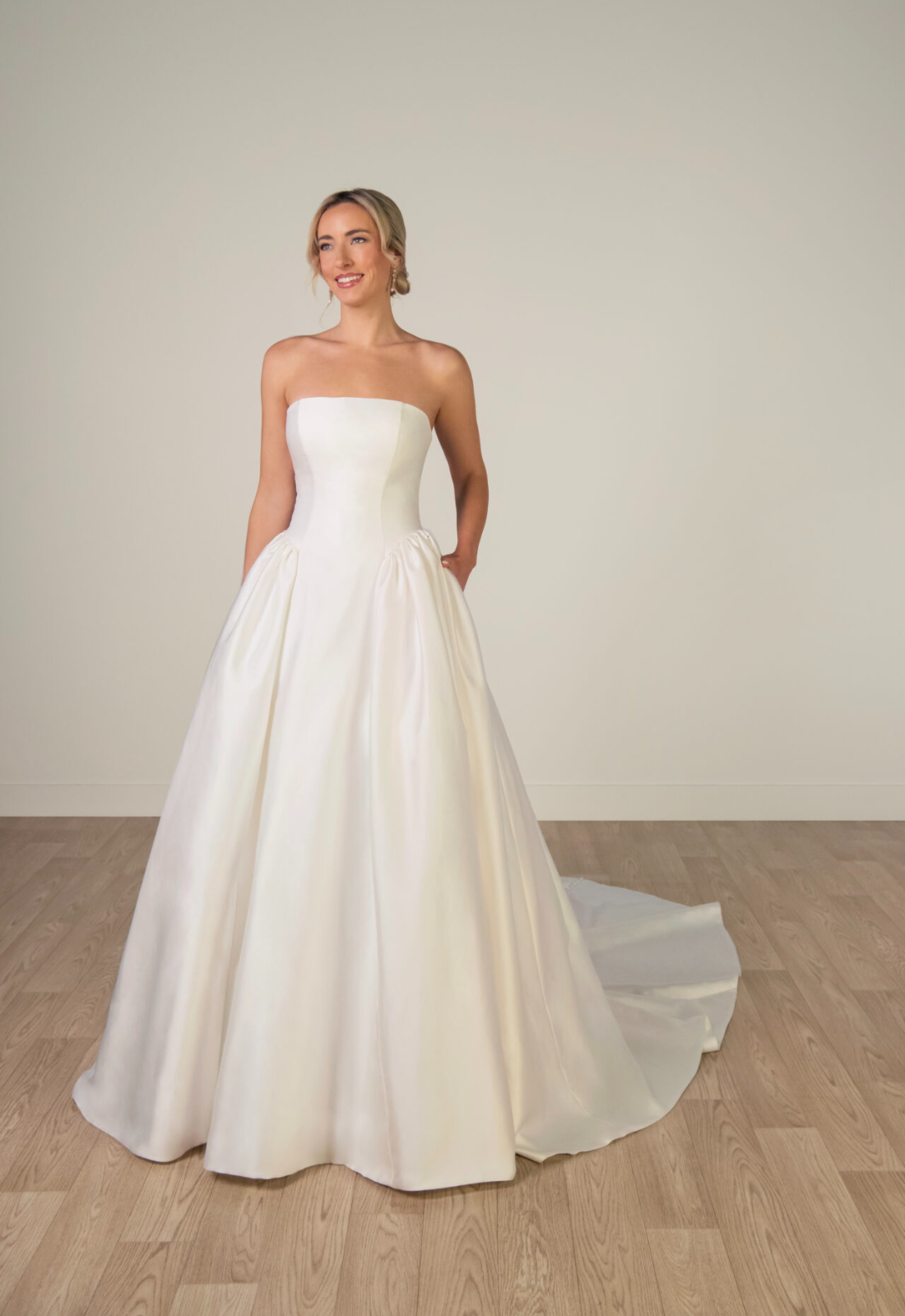 Heather - Stella's Bridal Stella York SY8274 wedding dress featuring a ballgown silhouette with straight neckline, satin skirt, and gathered details. Available at Stella’s Bridal in Westminster, Maryland.
