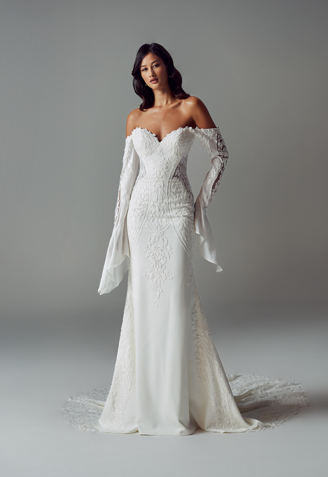 Evie Young Janie wedding dress featuring a fitted silhouette with sweetheart neckline, crepe skirt, and boho lace details. Available at Stella’s Bridal in Westminster, Maryland.