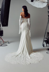 Evie Young Janie wedding dress featuring a fitted silhouette with sweetheart neckline, crepe skirt, and boho lace details. Available at Stella’s Bridal in Westminster, Maryland.