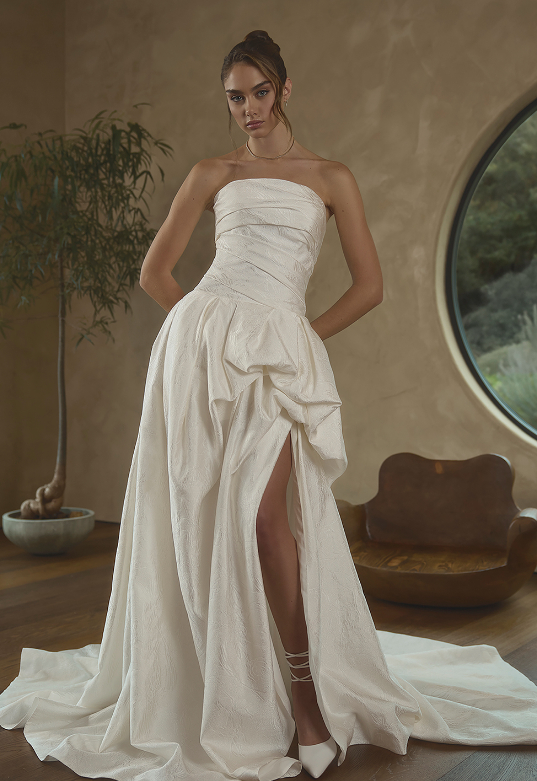 Jessa - Stella's Bridal Casablanca Jessa wedding dress featuring a dropped waist ballgown silhouette with straight neckline, brocade skirt, and pick-up details. Available at Stella’s Bridal in Westminster, Maryland.