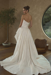 Jessa - Stella's Bridal Casablanca Jessa wedding dress featuring a dropped waist ballgown silhouette with straight neckline, brocade skirt, and pick-up details. Available at Stella’s Bridal in Westminster, Maryland.