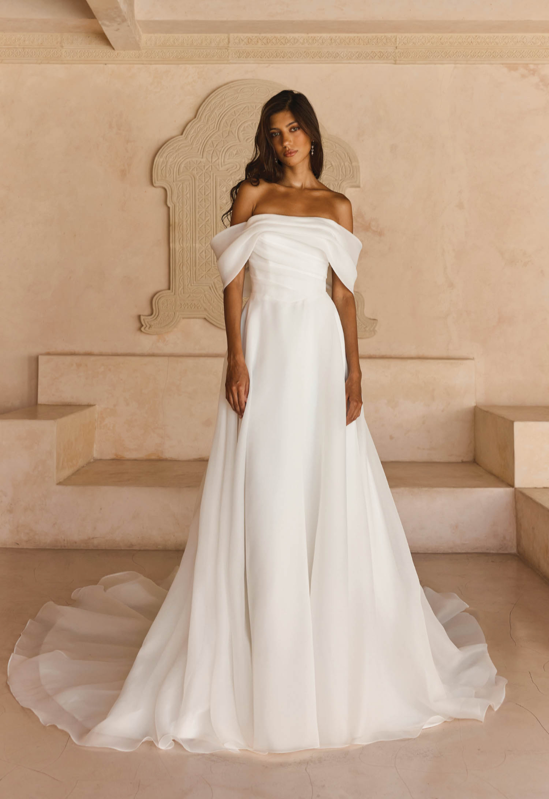 Lissy - Stella's Bridal Serene by Madi Lane Lissy wedding dress featuring an a-line silhouette with straight neckline, organza skirt, and pleated details. Available at Stella’s Bridal in Westminster, Maryland.