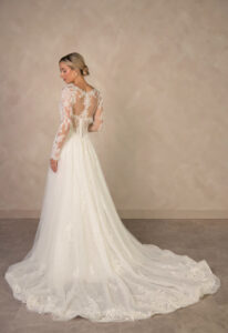 Essense of Australia D4577 wedding dress featuring an a-line silhouette with long sleeve v-neck neckline, tulle skirt, and sparkling lace details. Available at Stella’s Bridal in Westminster, Maryland.