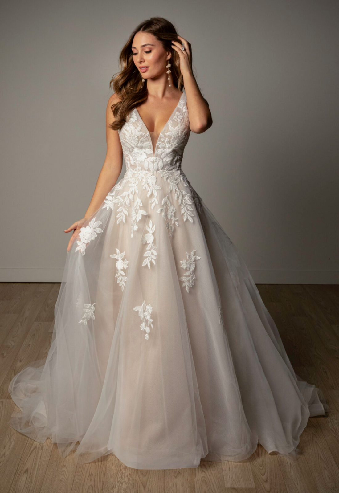Linton - Stella's Bridal Stella York SY8316 wedding dress featuring an a-line silhouette with v-neck neckline, tulle skirt, and boho lace details. Available at Stella’s Bridal in Westminster, Maryland.