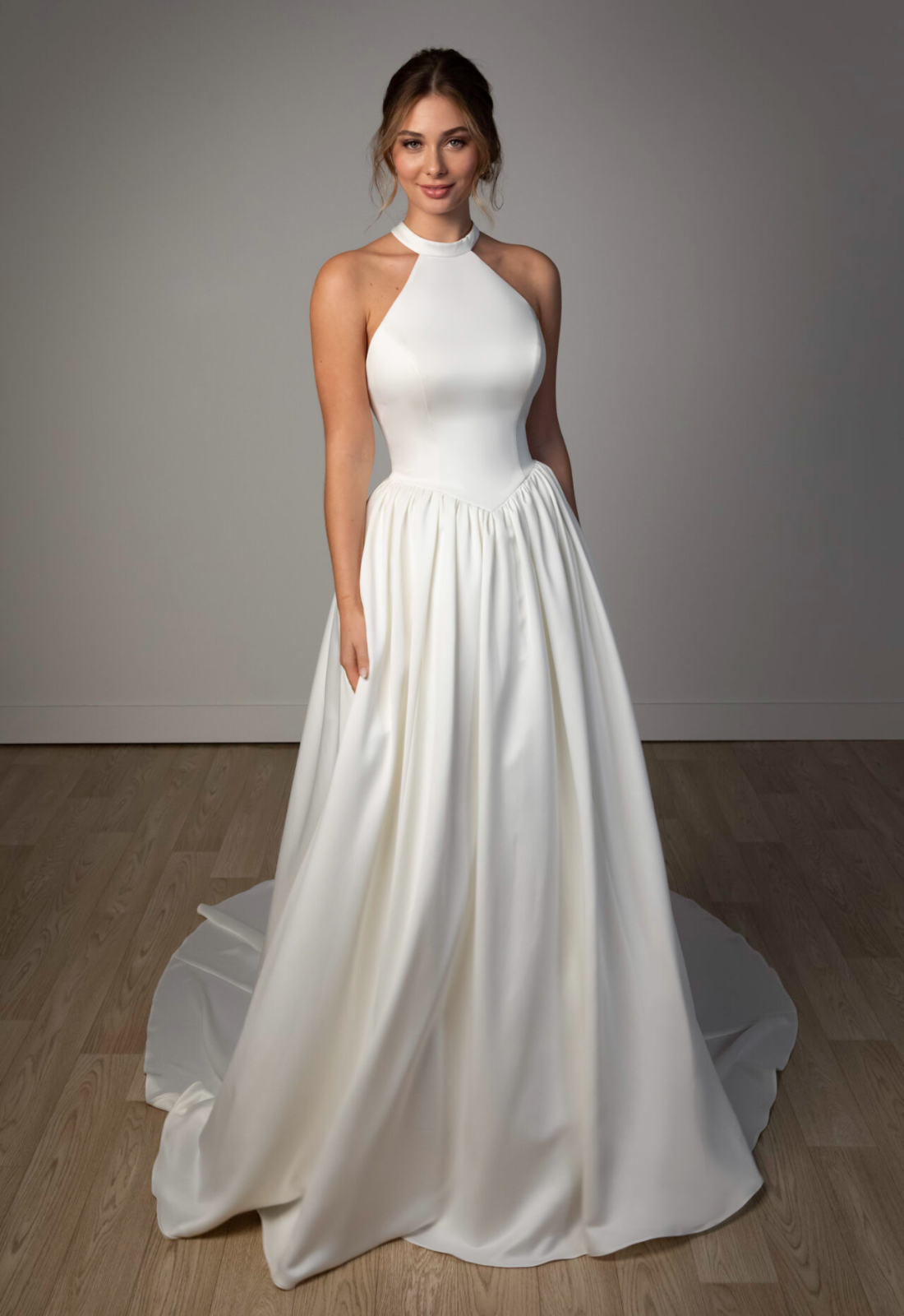 Lockwood - Stella's Bridal Stella York SY8273 wedding dress featuring an a-line silhouette with halter neckline, satin skirt, and pleated details. Available at Stella’s Bridal in Westminster, Maryland.