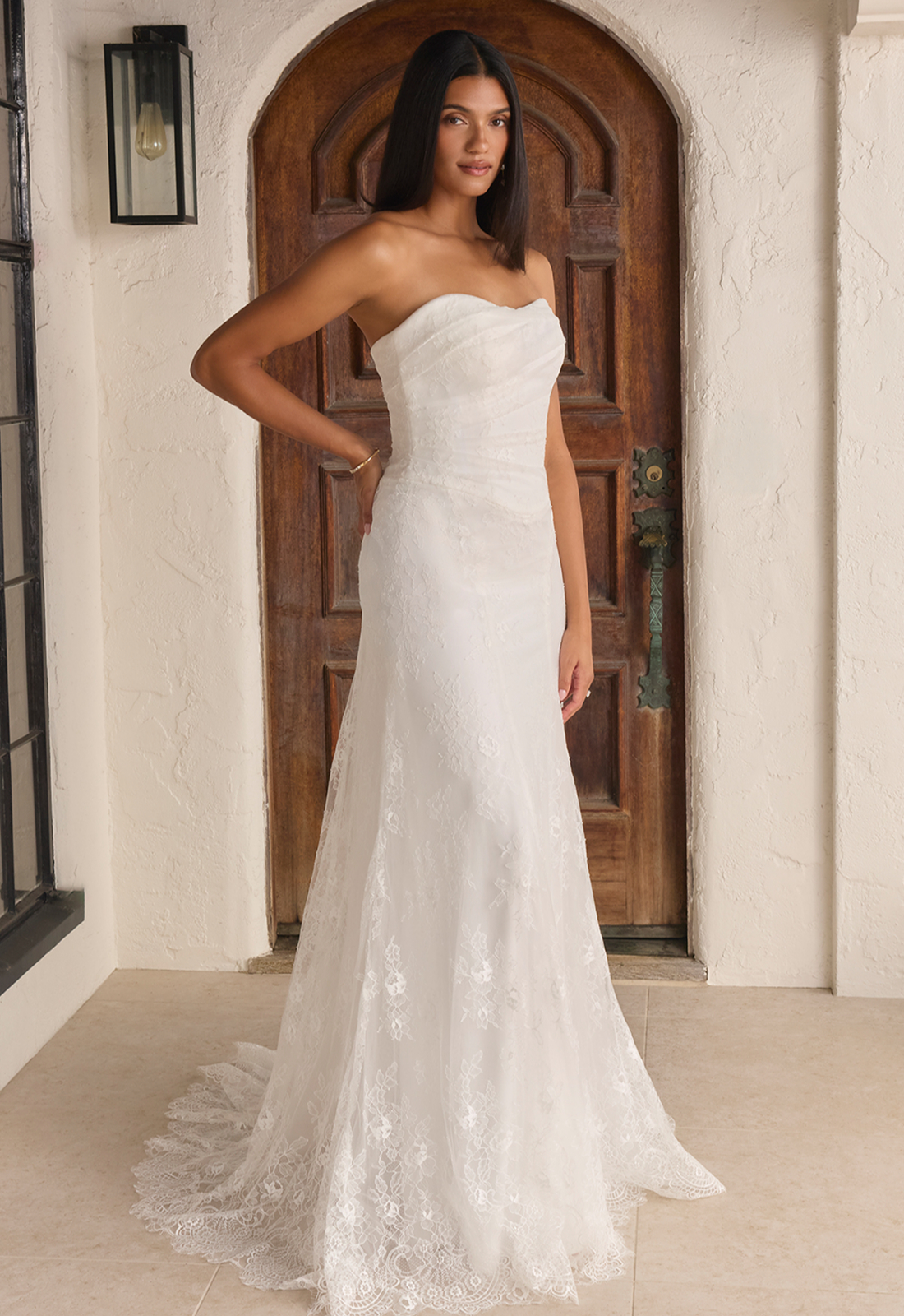Marissa - Stella's Bridal Beloved by Casablanca Marissa wedding dress featuring a fitted silhouette with sweetheart neckline, lace skirt, and ruched details. Available at Stella’s Bridal in Westminster, Maryland.