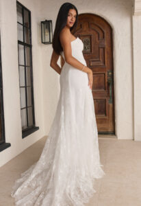 Beloved by Casablanca Marissa wedding dress featuring a fitted silhouette with sweetheart neckline, lace skirt, and ruched details. Available at Stella’s Bridal in Westminster, Maryland.