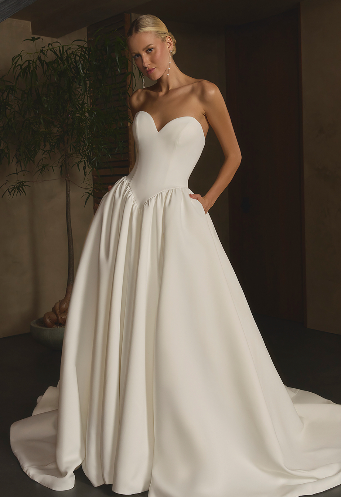 Nina - Stella's Bridal Casablanca Nina wedding dress featuring a ballgown silhouette with sweetheart neckline, satin skirt, and basque waist details. Available at Stella’s Bridal in Westminster, Maryland.