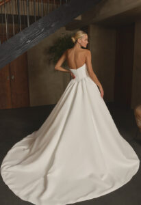 Nina - Stella's Bridal Casablanca Nina wedding dress featuring a ballgown silhouette with sweetheart neckline, satin skirt, and basque waist details. Available at Stella’s Bridal in Westminster, Maryland.