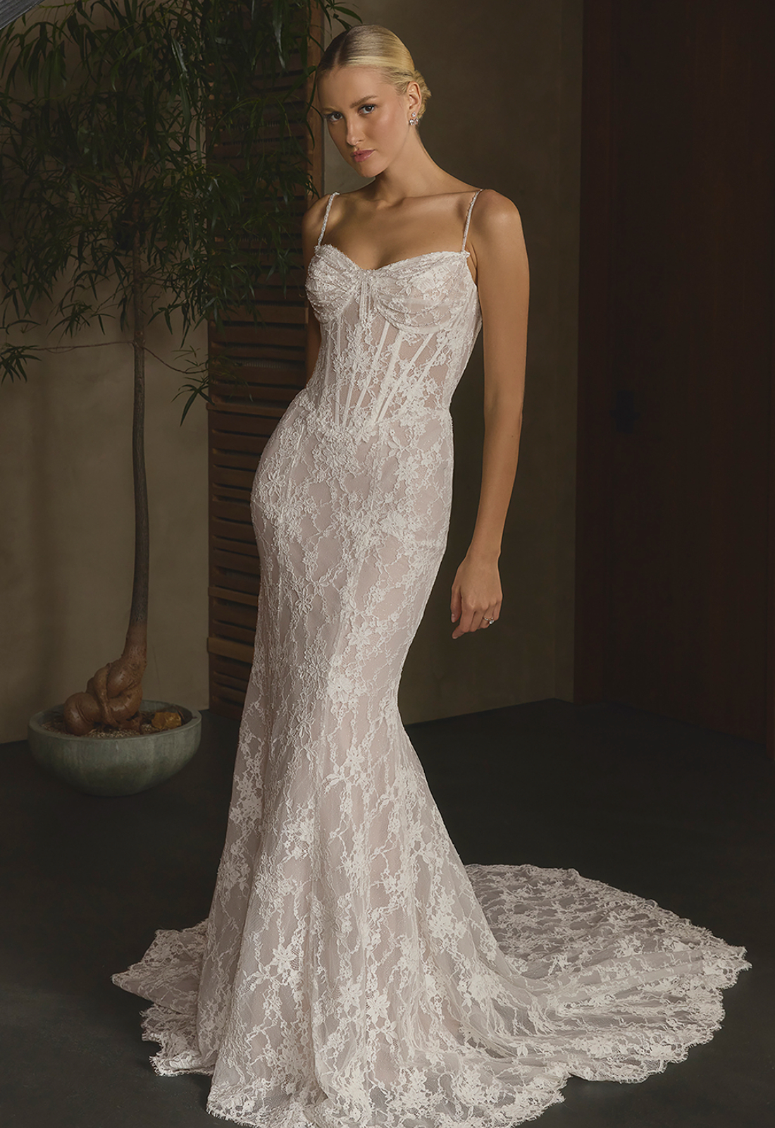 Oksana - Stella's Bridal Casablanca Oksana wedding dress featuring a fitted silhouette with sweetheart neckline, chantilly lace skirt, and corseted details. Available at Stella’s Bridal in Westminster, Maryland.
