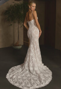 Casablanca Oksana wedding dress featuring a fitted silhouette with sweetheart neckline, chantilly lace skirt, and corseted details. Available at Stella’s Bridal in Westminster, Maryland.