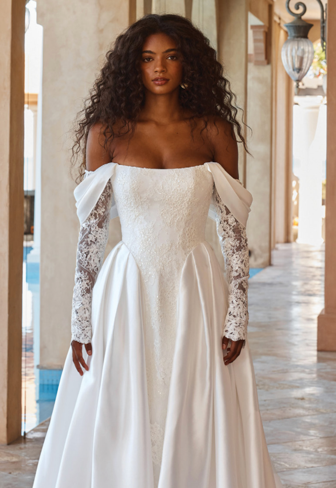 Olexa - Stella's Bridal Madi Lane Olexa wedding dress featuring an a-line silhouette with scoop neckline, satin skirt, and lace details. Available at Stella’s Bridal in Westminster, Maryland.