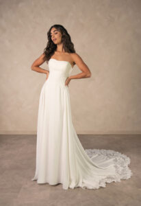 Rebecca - Stella's Bridal Essense of Australia D4504 wedding dress featuring an a-line silhouette with straight neckline, crepe skirt, and lace details. Available at Stella’s Bridal in Westminster, Maryland.