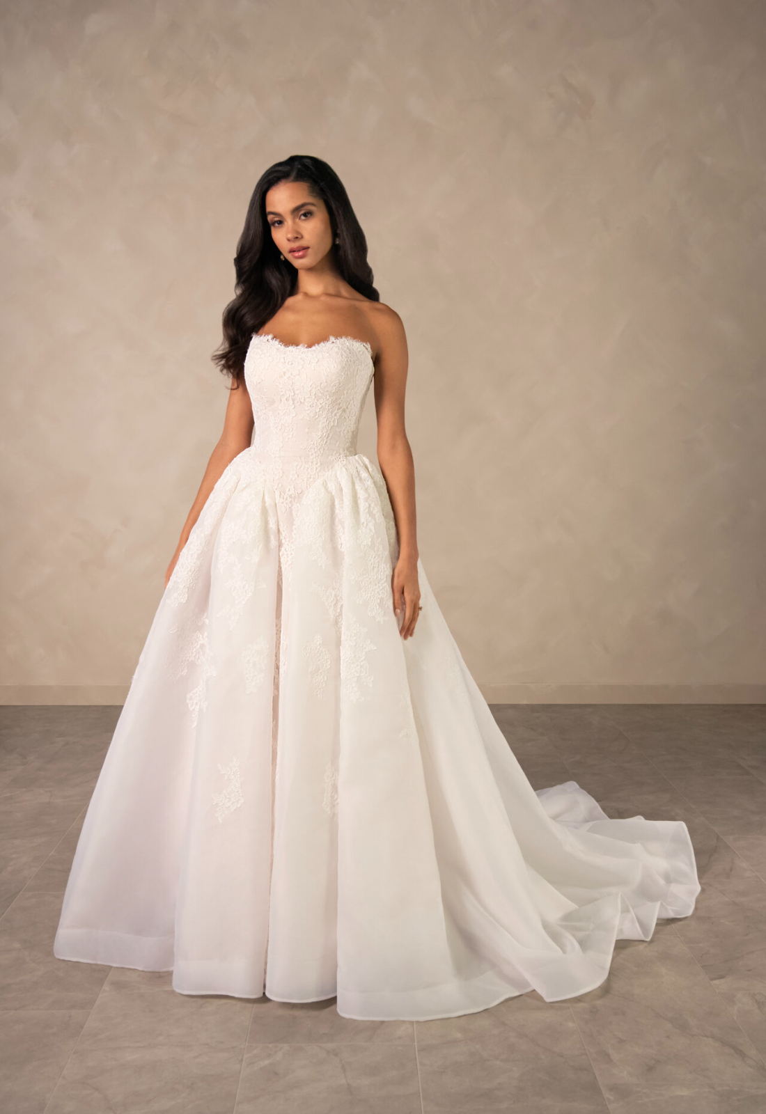 Rina Essense of Australia D4573 wedding dress featuring a ballgown silhouette with straight neckline, organza skirt, and lace details. Available at Stella’s Bridal in Westminster, Maryland.