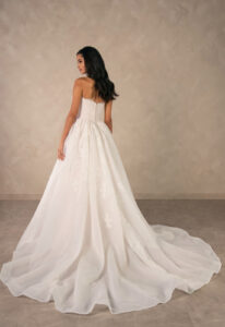 Rina - Stella's Bridal Essense of Australia D4573 wedding dress featuring a ballgown silhouette with straight neckline, organza skirt, and lace details. Available at Stella’s Bridal in Westminster, Maryland.