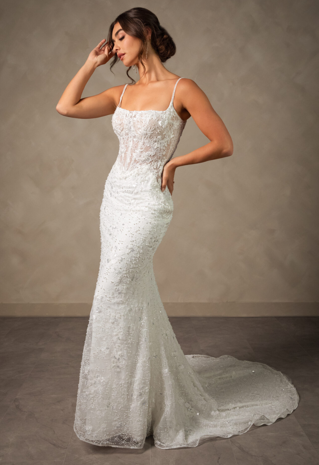 Tess Essense of Australia D4567 wedding dress featuring a fitted silhouette with square neckline, beaded lace skirt, and sparkling details. Available at Stella’s Bridal in Westminster, Maryland.