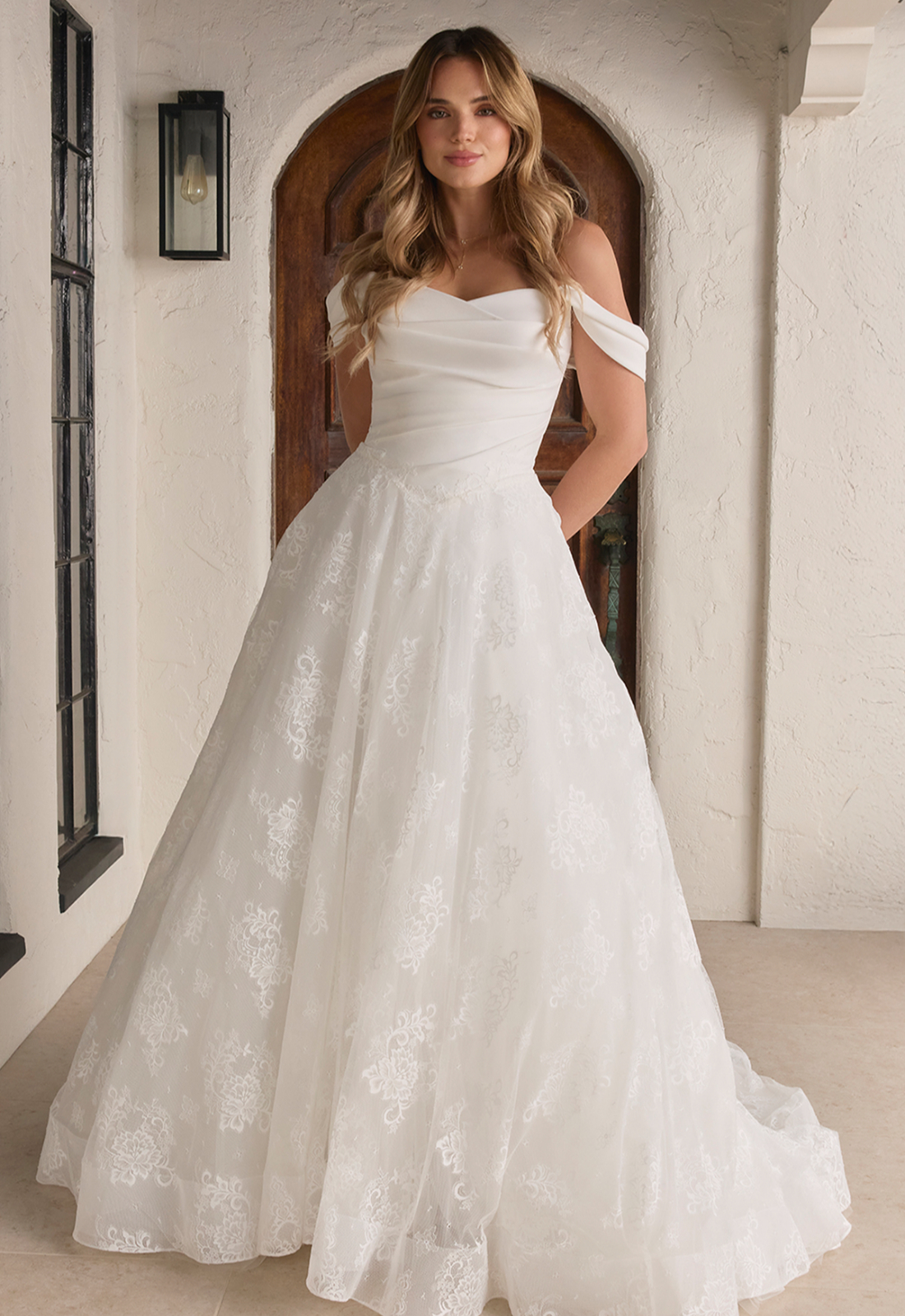 Vina - Stella's Bridal Beloved by Casablanca Vina wedding dress featuring a soft a-line silhouette with sweetheart neckline, lace skirt, and ruched details. Available at Stella’s Bridal in Westminster, Maryland.