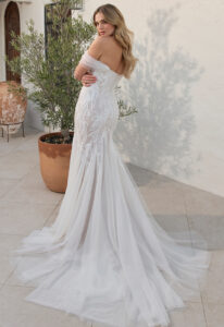 Wynn - Stella's Bridal Beloved by Casablanca Wynn wedding dress featuring a mermaid silhouette with sweetheart neckline, boho lace skirt, and cap sleeve details. Available at Stella’s Bridal in Westminster, Maryland.