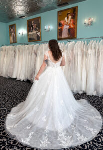 Cordelia - Stella's Bridal Love it at Stella's Exclusive Cordelia wedding dress featuring an a-line silhouette with v-neck neckline, sparkling lace skirt, and cap sleeve details. Available at Stella’s Bridal in Westminster, Maryland.