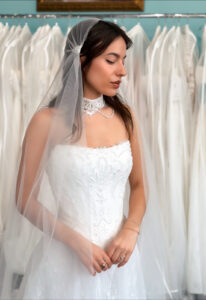 Love it at Stella's Exclusive Diana two-piece wedding dress featuring an a-line silhouette with straight neckline, soft lace skirt, and beaded details. Available at Stella’s Bridal in Westminster, Maryland.