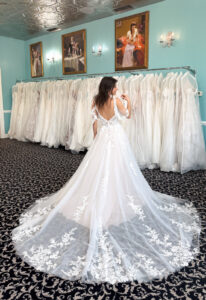 Rosalin - Stella's Bridal Love it at Stella's Exclusive Rosalin wedding dress featuring an a-line silhouette with v-neck neckline, flutter sleeves, and floral lace details. Available at Stella’s Bridal in Westminster, Maryland.
