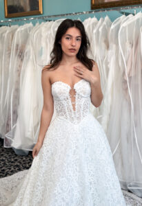 Ophelia - Stella's Bridal Love it at Stella's Exclusive Ophelia wedding dress featuring an a-line silhouette with cut-out sweetheart neckline, detachable sleeves, and illustrative lace details. Available at Stella’s Bridal in Westminster, Maryland.