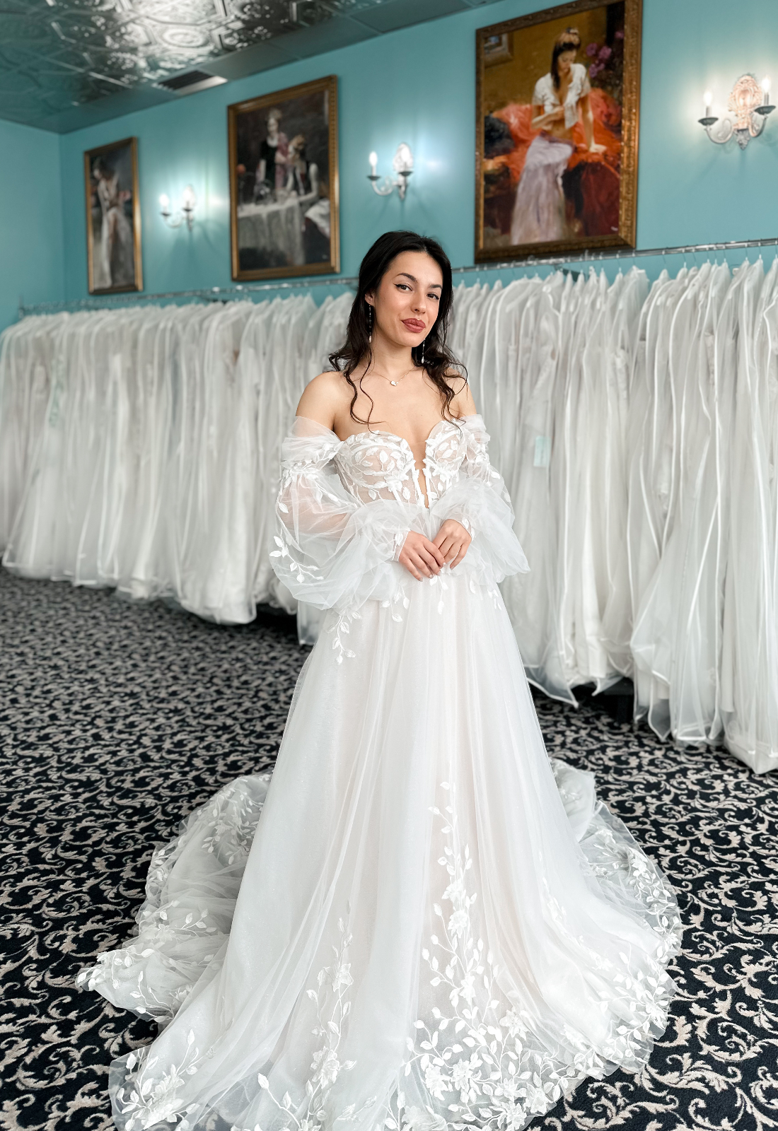 Shreya - Stella's Bridal Love it at Stella's Exclusive Shreya wedding dress featuring an a-line silhouette with plunging sweetheart neckline, detachable sleeves, and leafy lace details. Available at Stella’s Bridal in Westminster, Maryland.
