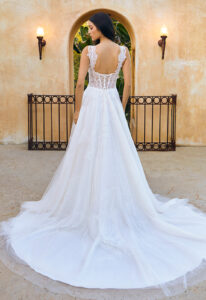 Cordelia - Stella's Bridal Casablanca Bridal Cordelia BL445 wedding dress featuring an a-line silhouette with cut-out sweetheart neckline, detachable sleeves, and illustrative lace details. Available at Stella’s Bridal in Westminster, Maryland.