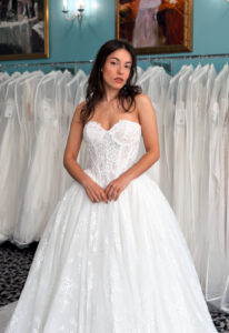 Anneliese - Stella's Bridal A wedding gown from Stella's Private Collection featuring exclusive bridal design elements such as intricate lace, elegant draping, luxurious fabrics, and timeless silhouettes. Each gown is uniquely curated and available exclusively at Love it at Stella's Bridal.