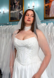 A wedding gown from Stella's Private Collection featuring exclusive bridal design elements such as intricate lace, elegant draping, luxurious fabrics, and timeless silhouettes. Each gown is uniquely curated and available exclusively at Love it at Stella's Bridal.