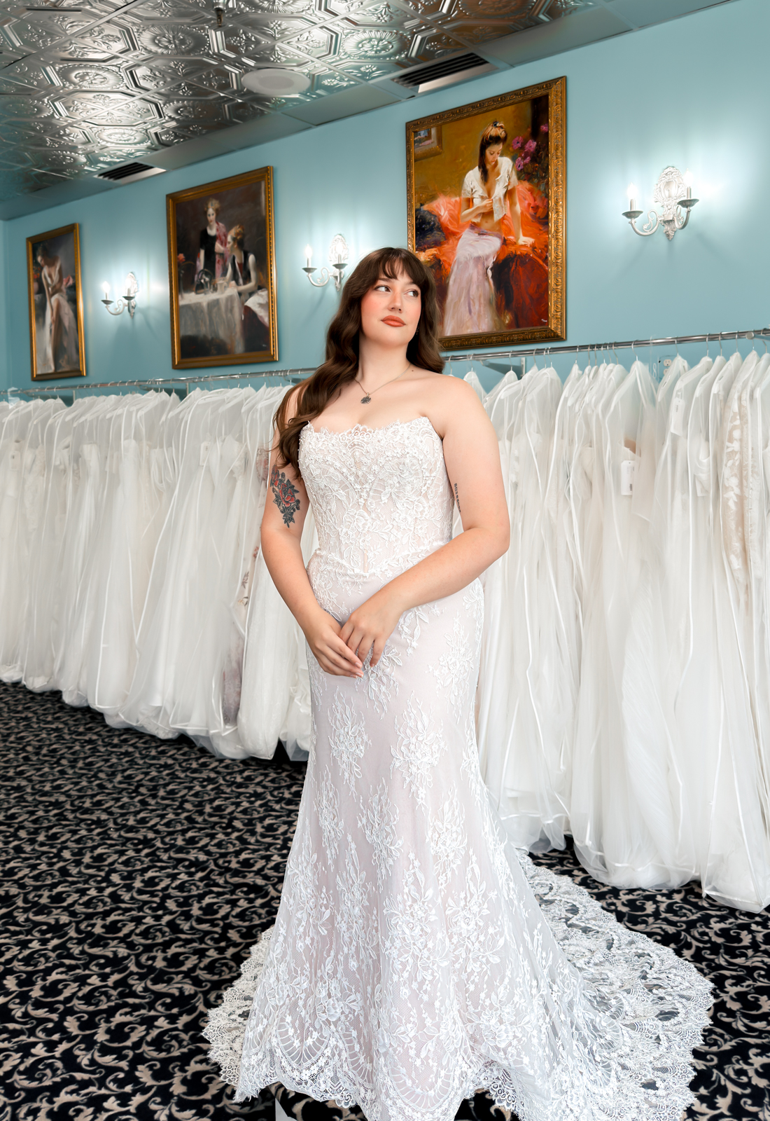 A wedding gown from Stella's Private Collection featuring exclusive bridal design elements such as intricate lace, elegant draping, luxurious fabrics, and timeless silhouettes. Each gown is uniquely curated and available exclusively at Love it at Stella's Bridal.