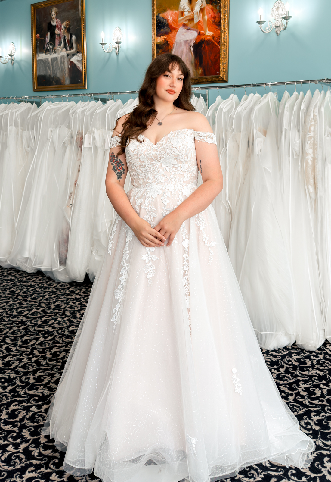 A wedding gown from Stella's Private Collection featuring exclusive bridal design elements such as intricate lace, elegant draping, luxurious fabrics, and timeless silhouettes. Each gown is uniquely curated and available exclusively at Love it at Stella's Bridal.